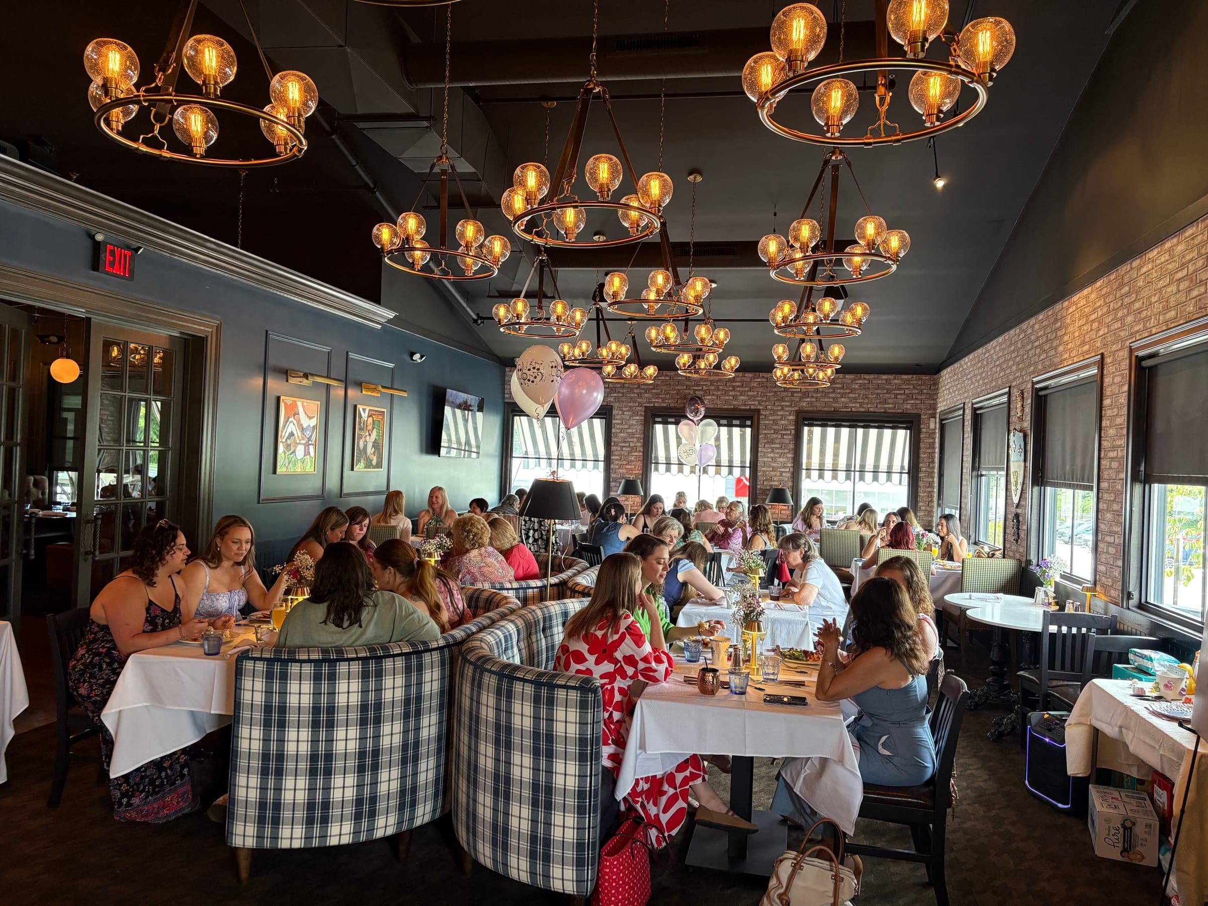 Guests seated for a baby shower brunch in The Library at Crown Tavern in Glen Mills, PA