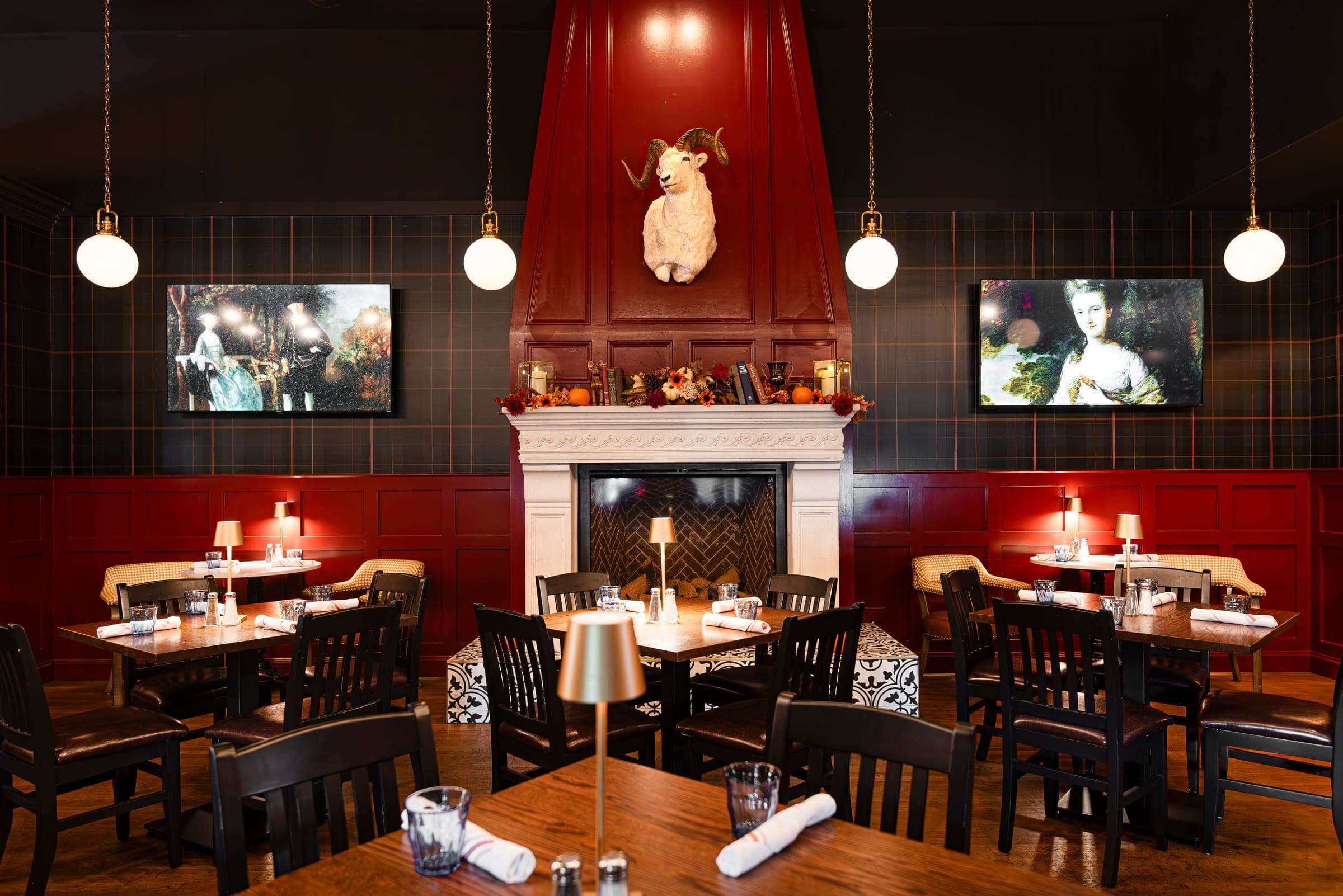 Red fireplace dining room with tartan walls at The Crown Tavern in Glen Mills, PA