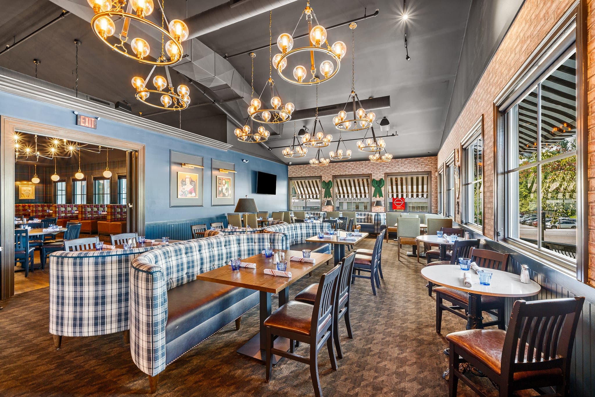 The Library private dining room with tartan banquettes and chandeliers set for a client dinner at Crown Tavern in Glen Mills, PA